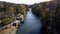 View park, fountain, lake, trees, large stones on banks on sunny autumn day