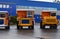 View of the parking lot of an exhibition of large career heavy dump trucks at the automobile plant Belaz