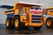 View of the parking lot of an exhibition of large career heavy dump trucks at the automobile plant Belaz