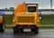 View of the parking lot of an exhibition of large career heavy dump trucks at the automobile plant Belaz