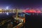 View at the part of an old ship, old railway bridge and distant city lights at night, Belgrade, Serb