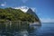 A view past boats moored in Soufriere Bay towards Petit Piton in St Lucia