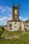 A view past the ruins of a church on the hill above St George in Grenada