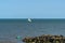 A view past sea defenses out to sea at Clacton on Sea, UK