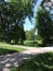 View  of path, island on the lake in sunny park of Saint-Petersburg