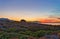 View on path leading to calm sea during beautiful sunset