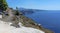 A view of the path from Skaros Rock along the rim of the caldera in Santorini