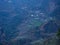 View from the path to Annapurna Base Camp to the evening upper Chomrong with surrounding cliffs and rice terraces