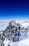 A view of the peak of Mont Blanc mountain with a blue sky