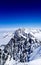 A view of the peak of Mont Blanc mountain with a blue sky