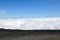 View from the peak of a mountain at the clouds