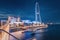 view from the pedestrian bridge on Blue waters Island with decorative lighting and one of the largest ferris wheels in the