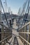 View of a pedestrian wood structure and recreational and private boats in Marina