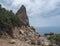 View of Pedra Longa, limestone rock pillar at coast Gulf of Orosei, beginning of the famous and difficult hiking