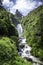 View of Peguche Waterfall in the mountains of Ecuador.