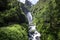 View of Peguche Waterfall in the mountains of Ecuador