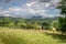 A view of Pendle Hill and gathering rain clouds.