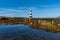 View of the Penmon Lighthouse in North Wales with a tidal pool in the foreground