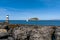 View of the Penmon Lighthouse and Puffin Island in North Wales