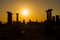 View of people and historical ruins at sunset captured in the temple of Athena at the ancient city of Assos