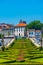 View of people passing over jardim do largo da Republica do Brasil square in Portuguese city Guimaraes