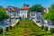 View of people passing over jardim do largo da Republica do Brasil square in Portuguese city Guimaraes