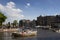 View of people riding open boats in Amstel river