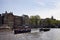 View of people riding open boats in Amstel river