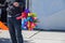 View of a person holding balloons of different colors on the street captured on a sunny day