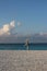 View of the photo zone on the shores of the Indian Ocean with a picturesque driftwood against the backdrop of white sand and azure