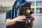 View of a photographer with an old-style vintage retro camera, old fashioned photo camera, man shooting photography in old style