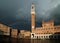 View From Piazza Del Campo To The Tower Torre Del Mangia And Palazzo Pubblico In The Old Town Of Siena Tuscany Italy