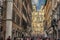 View on Piazza di Spagna, the Spanish Steps and the TrinitÃ  dei Monti church from busy Italian Street Via dei Condotti