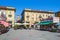 View of Piazza Ferrero under blue sky in Alba, Italy.