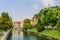 A view of the picturesque embankment of the Ljubljanica river and Ljubljana castle.