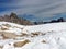 A view of the picturesque rocky mountains covered with snow. Winter natural landscape