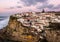 View of the Picturesque village Azenhas do Mar, on the edge of a cliff with a beach below