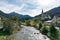 View of the picturesque village and church of Savognin on the Julia River in the Swiss Alps