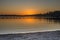 A view of a pier on a lake in a winter sunset at Juanita Bay Park, Kirkland, Washington