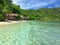 View from the pier to the beach on the island of Kri. Raja Ampat best place on earth. Paradise holiday