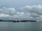 A view of Pilot boats alongside their next ship to guide into the Panama Canal and ships anchored waiting to enter the canal