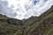 View of Pisac Archaeological Park and green mountains of the Sacred Valley of the Incas, Peru