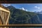 The view of Piz Beverin in Switzerland from the window of an old log stable during summer