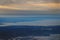 View from the plane to the island of Sakhalin, the mountains and the sea with the seaport