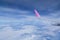 The view from the plane window,Wing of an airplane flying,Aircraft flying high through the cumulus clouds