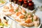 view of plate with appetizer canape with shrimp and sauce and white bread