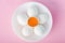 View of plate with flower made of eggs and egg yolk on pink