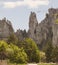 View from the plateau with trees growing on it, on the teeth of AI-Petri,between which people move along the hanging paths