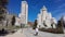 View of Plaza de EspaÃ±a. People in front of the monument in the square. Cervantes Monument