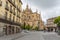 View at the Plaza Mayor and front view at the iconic spanish gothic building at the Segovia cathedral, towers and domes, downtown